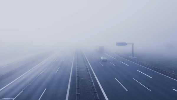 Người dân đi bộ trên một con phố ở Hà Nội được trang hoàng cho dịp Tết